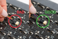 Ensure the cable is going in straight, with the pins on the cable facing downwards.
